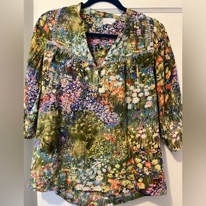 Very pretty, different top.   Looks like a watercolor painting.